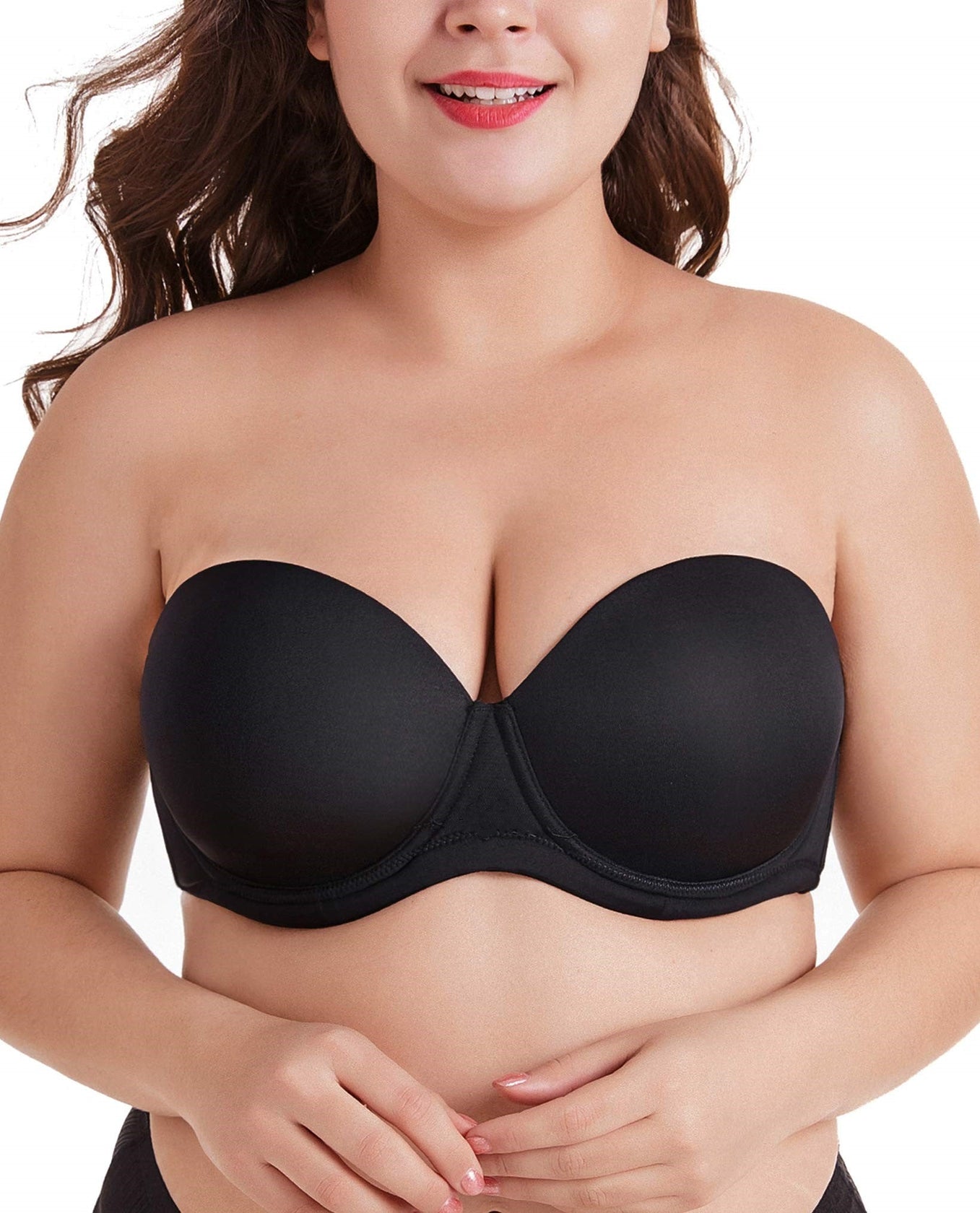 Young Beautiful Plus Size Modelt in Black Bra Holding Mannequin